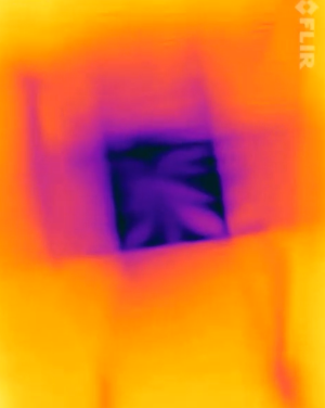 This IR camera image of a skylight shows that the skylight shaft is well-insulated and air sealed. A poorly insulated and air sealed skylight would show purple cold spots and streaks along the sides of the shaft. 