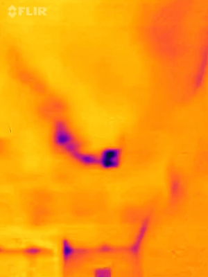 This IR camera image shows an HVAC duct in the attic that may have displaced insulation.