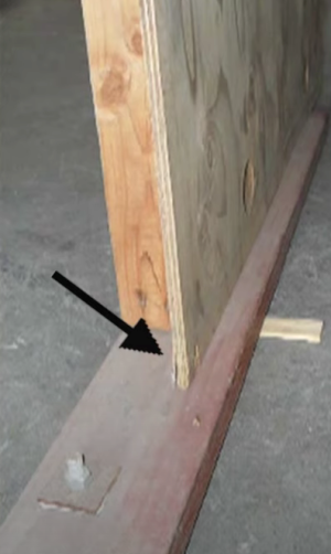 Incorrectly done seismic retrofit, the plywood sheathing is not nailed to the mud sill and therefore it is not providing any shear strength
