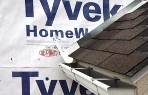 Install the house wrap. Cut house wrap to fit over diverter and tape top of cut wrap