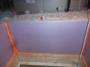 An insulation dam should surround the attic access and allow blown insulation to be installed to the required depth.