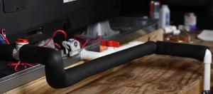 The condensate line on this air conditioner has been covered with pipe insulation (.
