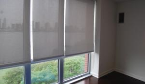 These interior solar screens help control glare and solar heat gain while maintaining view to the outside.