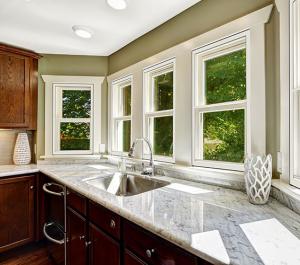 These interior storm windows have low-emissivity coatings to let in light while keeping out heat in the summer and keeping heat in in the winter 