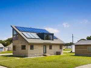 This home’s south-facing roof provides adequate space for both a solar electric system and solar thermal hot water system.