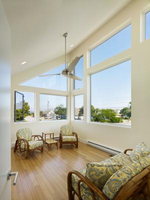 ENERGY STAR-rated ceiling fans and openable windows oriented to prevailing summer breezes help provide low-cost cooling.
