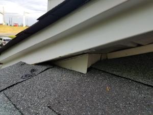 Wrong - Roof-wall juncture lacks metal flashing and is poorly designed, thus encouraging water entry.
