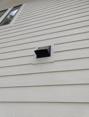 Right - This kitchen exhaust duct termination is integrated aesthetically and functionally with the exterior cladding. 