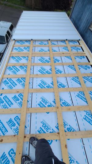 Right - A lattice of 1X4 furring strips provides a ventilation gap between the decking and metal roofing for this shed roof. 