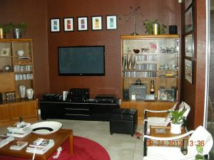 Example of an entertainment center where an advanced power strip might be used to control a DVD, game console, and speakers