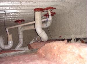 Right - The service penetrations through the structural slab in this garage plenum are air sealed. 