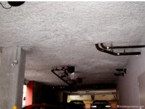 Thermally isolate heated garages in multifamily buildings from ambient space, and thermally isolate all garages in multifamily buildings from interior occupied space. This parking garage is thermally isolated from space above with spray foam insulation.