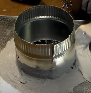 After connecting with sheet metal screws, this take-off collar is then air sealed and further secured using UL 181 fiber-reinforced duct sealant mastic paste.