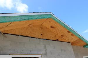 Right - Metal drip edge on this south Florida CMU home protects the top of the fascia and edge of the roof deck from water, wind-blown rain and embers, and insects.