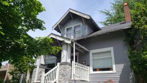 Wrong - There is no step flashing along the base of the gable and the right window is missing sill trim.