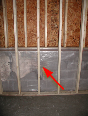Wrong - Class I vapor retarder over framed basement walls can cause condensation, mold, and rotting because plastic prevents drying to the inside; the outside should have waterproofing and vertical drainage, and the framing should be spaced from the wall.