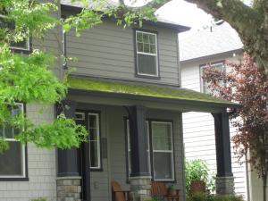 New roofs are not immune to moss, which can spread quickly under favorable conditions like constant shade and low roof pitch.