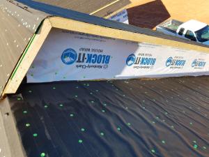 Wrong - Nailing pattern on roof underlayment is erratic and excessive, house wrap should overlap seam, metal step flashing will need to be installed at roof-wall junction.