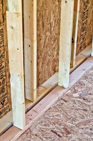 This home’s double-wall structure consists of two 2x4 walls set two inches apart, then sheathed on the exterior and netted on the interior to create a 9.5-inch wall cavity that is filled with blown fiberglass insulation.