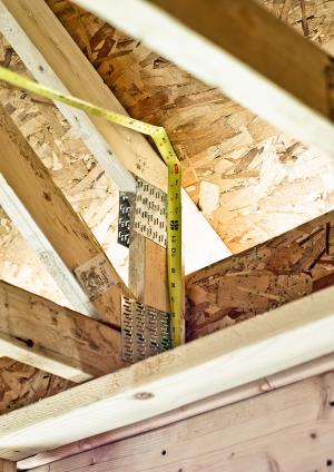 Right - These raised heel roof trusses provide 16 inches of space over the outer walls for full insulation coverage at the attic perimeter.