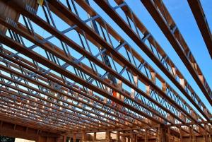 Open-web floor joists provide space for ducts between the floors of a two-story home.  
