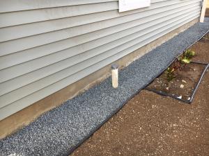 Pea gravel provides a pest-resistant perimeter around the foundation 