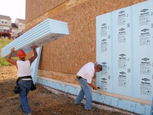 When rigid foam insulation is applied to the exterior side of the wall cavity under the cladding, with seams taped and an air gap provided, it acts as a vapor barrier, air barrier, and rain screen.