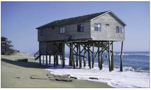The pilings for this building are showing signs of failure due to a poor siting decision to locate the home too close to the surf. 