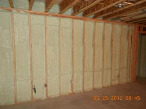 To ensure a complete air barrier between the garage and the house, the wall between the garage and the house was insulated and air-sealed with four inches of high-density spray foam.