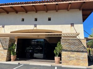 Right – deeply inset entryways and overhangs provide shade to reduce solar heat entry to this building.