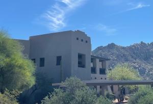 Right – thermal mass walls, small windows, and recessed porch and trees on the south side of this southwest home help to minimize solar heat gain.