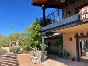 Right- Landscaping shades the entry on the south west corner of this hot dry climate building.