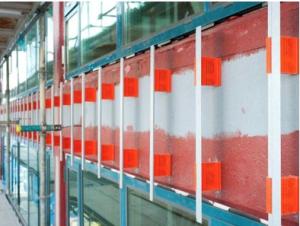 Right – Fiberglass connectors provide a thermal break between the metal cladding attachment and the wall assembly on this multistory multifamily building