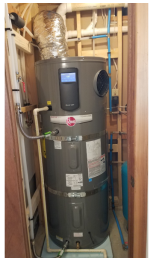 Right: This heat pump water heater is installed in a small space so the, intake air is ducted from an adjacent room; the water heater since on a pad of foam insulation and has a good drain line configuration but the waterpipes lack insulation