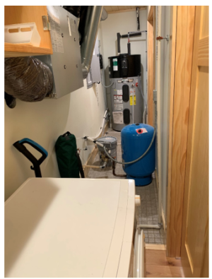Right: This heat pump water heater is installed in a utility closet where it can use heat from the clothes washer and heat pump clothes dryer and has access to a floor drain for condensate