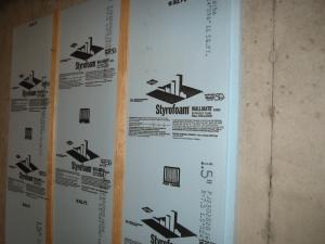 Rigid foam against the foundation