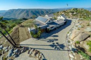 This home on a mountain top in San Ramon, California, has four 10,000-gallon stormwater/greywater cisterns (two are visible at top left) for fire suppression as well as five 10,000-gallon rainwater storage tanks for indoor potable water.