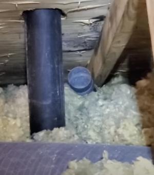 This bath fan duct is venting humid air directly into the attic and mold is visible on the roof sheathing above