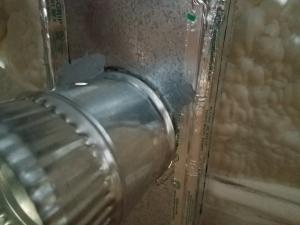 Wrong - The seam around the duct boot where the duct boot enters the trunk duct has not been completely sealed with mesh tape and mastic.
