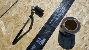 Right - Seam-sealing flashing tape is installed with roller to fully adhere to the OSB.