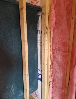 Wrong - No insulation was installed behind the shower surround.