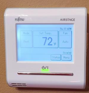 Example of a proprietary communicating thermostat made by the same brand as the heat pump equipment manufacturer 