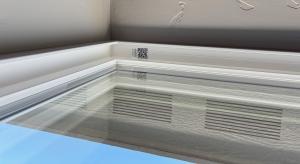 In this photo, the soffit vents are visible through the window