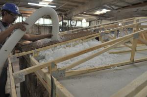 Southern Energy Homes worked with DOE researchers to develop an efficient way to dense-pack blown fiberglass into the low attics of manufactured homes.