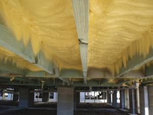 Right – This floor system on a column foundation is insulated using closed-cell spray foam rather than fibrous insulation 