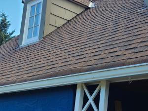 Wrong - Step flashing is missing where the gable meets roof and the valley flashing is incorrectly on top of rather than under shingles.