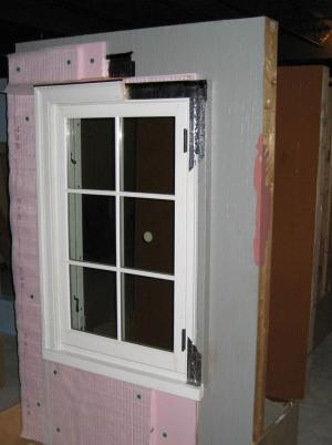 Two layers of XPS are installed with staggered seams over a liquid-applied membrane on the structural sheathing