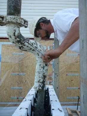 A pumper is used to place the concrete into the foam form walls