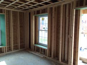 Right - Double-stud wall are boxed with plywood around windows and doors
