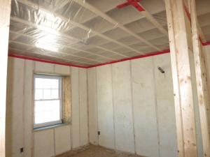 Right – Open-cell spray foam fills the cavity in this these double-stud walls